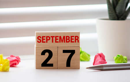 27 September of calendar wooden on table, word tourism day concept.の写真素材