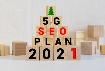 Wooden blocks with the inscription 2021 goal. The concept of achieving business goals. Execution of...