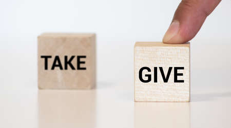 Give and Take text on wooden block, business conceptの写真素材