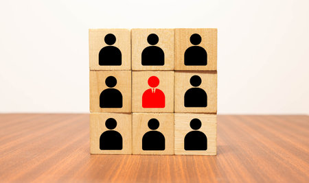 Business hierarchy chart made of wooden cubes on table, copy space. Company, organization structure....