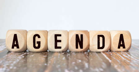 Agenda - words from wooden blocks with letters, a list of matters agenda concept, white backgroundの写真素材