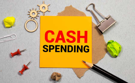 Cash Spending text written on notebook with pen and chartの写真素材