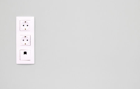 White double socket on white background.Electric plug. European high voltage 220W sockets.High...