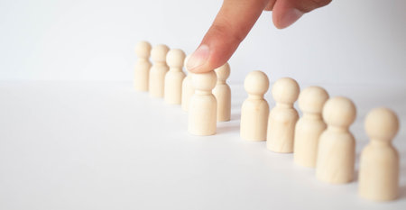 Human resources management and recruitment business build team concept, Hand putting wood cube block on top, Copy spaceの写真素材