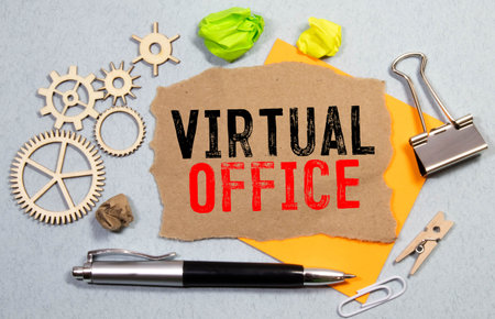 VIRTUAL OFFICE text with notepad, laptop, fountain pen and decorative plant on red background....