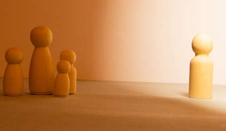 Origami of man and woman and a heart cut between them and a divorce message.の写真素材