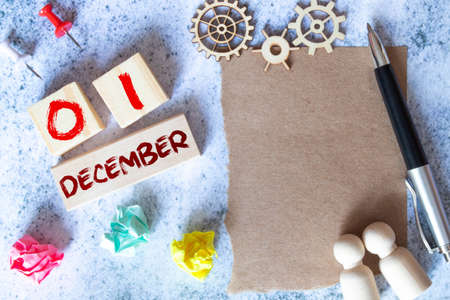 wooden calendar with the date of December 1 and an easel on a blue background, place for text, World AIDS Dayの写真素材