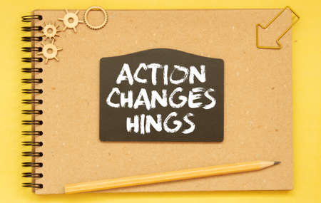 text Action Changes Things on black card.の写真素材
