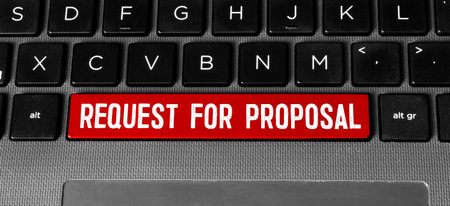 The text, the inscription, the phrase Reguest for Proposal is written in a notebook that lies on a dark table with a laptop and pen. Business concept.の写真素材