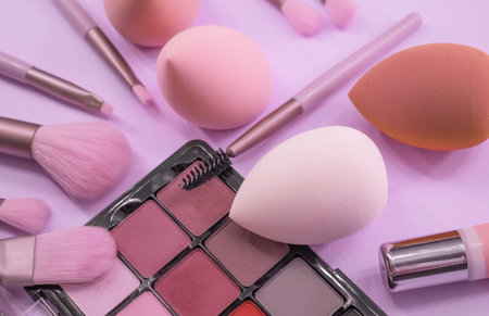 various makeup products and cosmetics isolated on pink background.の写真素材