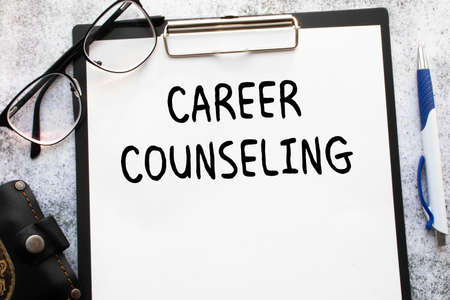 CAREER COUNSELING. text, word, on white paper on gray backgroundの写真素材