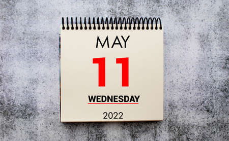 may 11. 11th day of month, calendar date. Stand for desktop calendar on beige wooden background. Concept of day of year, time planner, spring month.の写真素材