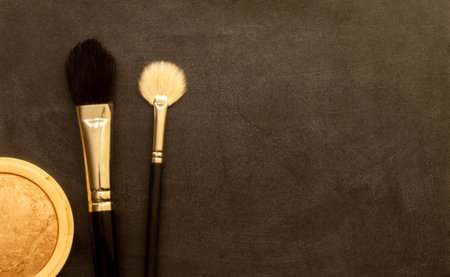 Set of makeup products and accessories to even out skin tone and complexion. Shallow depth of field.