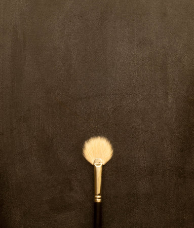 powder brush, kabuki brush and loose powder with an elegant gold theme to create a charming makeup.
