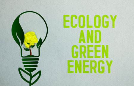 ecological concept. On a white-green background lies a pen, a leaf of a plant and a notepad with the...