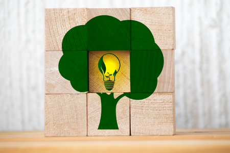 plant save the world concept. Net zero greenhouse gas emissions target. Climate neutral long term strategy. wooden cubes with green net zero icon and green icon on green nature background.の写真素材