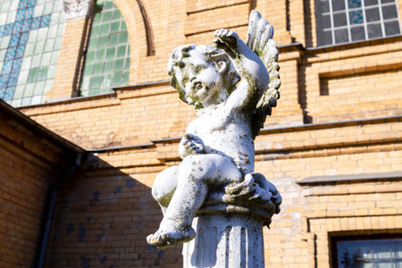 Guardian angel statue in sunlight as a symbol of strength, truth and faith