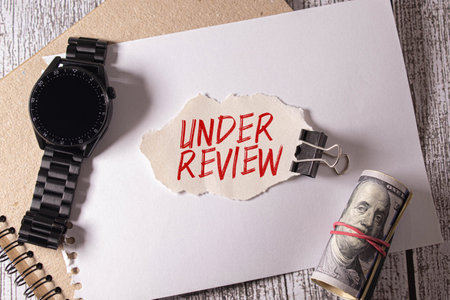under review text write on paper.の写真素材