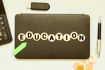Education - word from wooden blocks with letters, education concept on white background with cactusの写真素材
