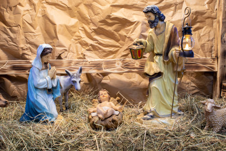 Christmas Manger scene with figurines including Jesus, Mary, Joseph, sheep and magiの写真素材