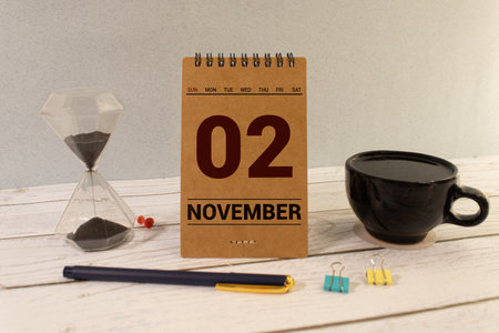 November 2nd. November 2 white wooden calendar on vintage wood abstract background. Autumn day. Copyspace for your text.の写真素材