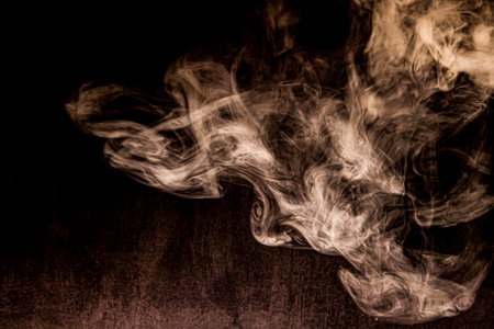 Smoke fragments on a black background.の写真素材
