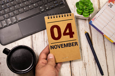 November 4 calendar date text on wooden blocks with copy space for ideas or text. Copy space and calendar concept.の写真素材