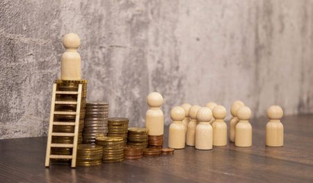 The businessman climbs the stacks of coins, art collage. Success and innovation in the financial sector.の写真素材