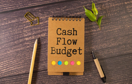 Cash flow text concept on notebook with office tools and paper. Business concept.の写真素材