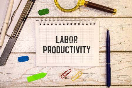 Four-day work week concept with three red letter days on wooden chips on dark backgroundの写真素材
