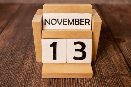 13 November on wooden grey cubes. Calendar cube date 13 November. Concept of date.の写真素材