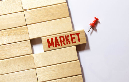 market share symbol. Concept words Market share on beautiful wooden block. Beautiful orange table orange background. businessman hand. Business and market share concept. copyspace.の写真素材