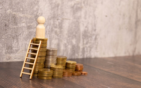 coin ladder, wooden figures, cunning and ingenuityの写真素材