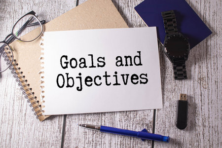 Notepad with GOALS OBJECTIVES text inscription on notepad on a light background.の写真素材