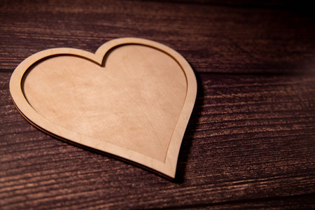 Heart shape wooden tray on white background.の写真素材