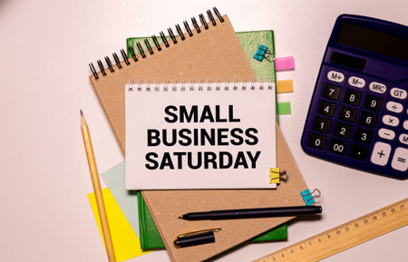 Small Business Saturday - shopping holiday held during the Saturday after Thanksgiving, one of the busiest shopping periods of the year, text concept on notepad