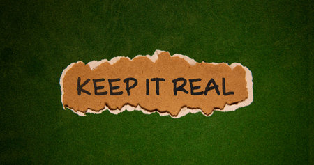 The text keep it real appearing behind torn gray paper.の写真素材