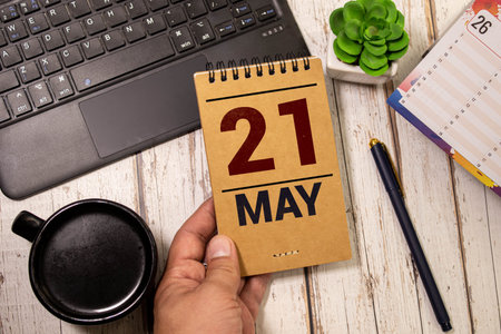 May 21st. Image of may 21 wooden color calendar on white background. Spring day, empty space for textの写真素材