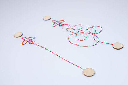 Legs in white sneakers in front of straight and tangled arrowsの写真素材