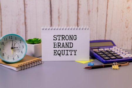 businessman hold notepad with text STRONG. White background. Business conceptの写真素材