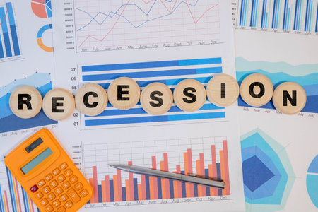 Business and recession fears concept. Copy space. Concept words Recession fears a conceptual phrase on wooden blocks lying on old boardsの写真素材