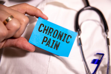 Pain Relief symbol. Concept word Pain Relief on wooden blocks. Beautiful blue background with pills.