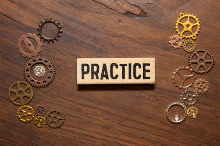 Practice word wooden cubes on pink background.