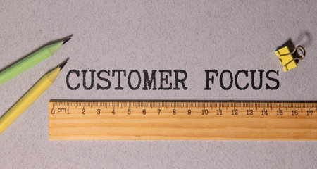 envelope with money magnifying glass. text Customer Focus.の写真素材