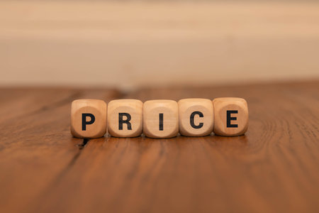 Price symbol. Wooden cubes with word Price. Beautiful orange background. Price concept. Copy space.の写真素材