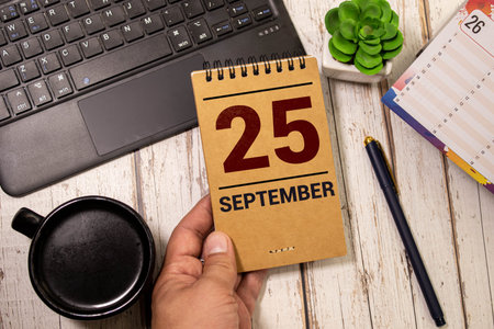 September 25 calendar date text on wooden blocks with copy space for ideas or text. Copy space and...