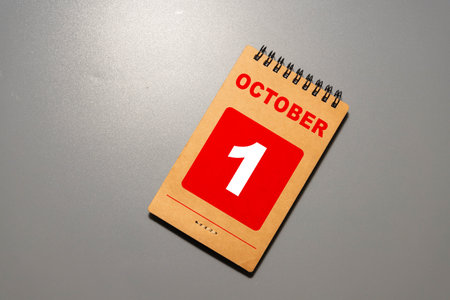 Vintage photo, October 1st. Date of 1 October on wooden cube calendar, copy space for text on boardの写真素材