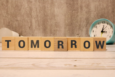 A wooden blocks with the word TOMORROWの写真素材