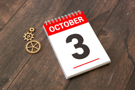 October 3rd. Day 3 of month, calendar on insurance agent workplace background. Autumn time. Empty...