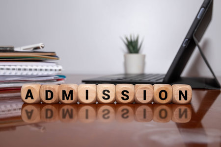 ADMISSION word written on wood block. ADMISSION text on table for your design, concept.の写真素材